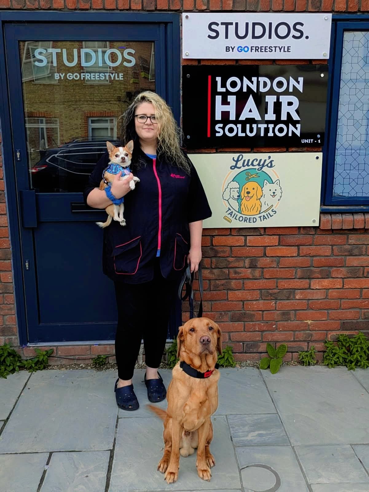 Lucy grooming a small dog